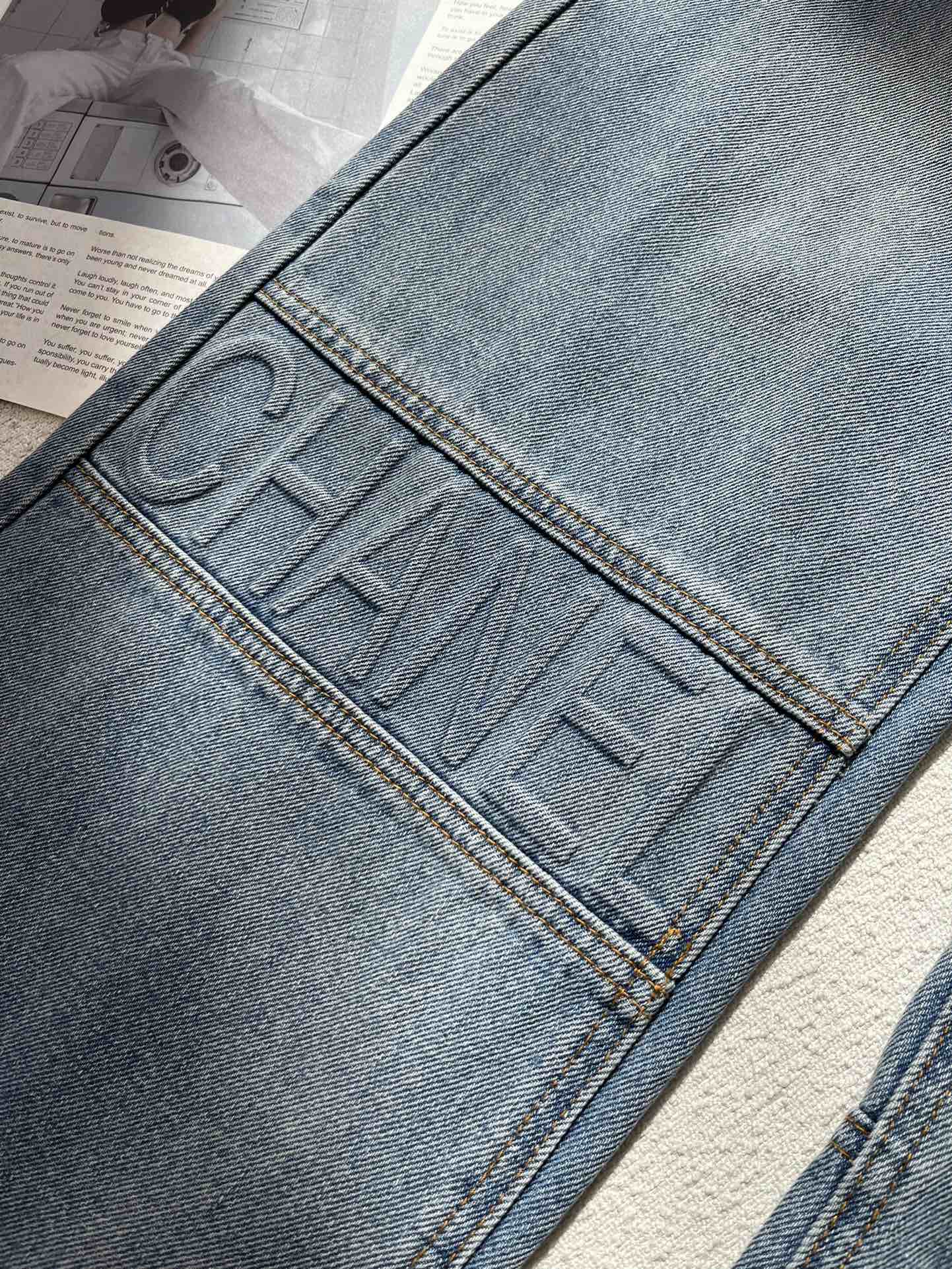 0528 Embossed letter jeans